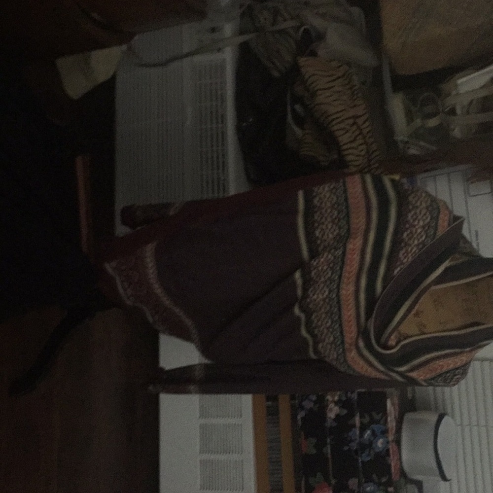 Mult-colored sweater with sleeves.